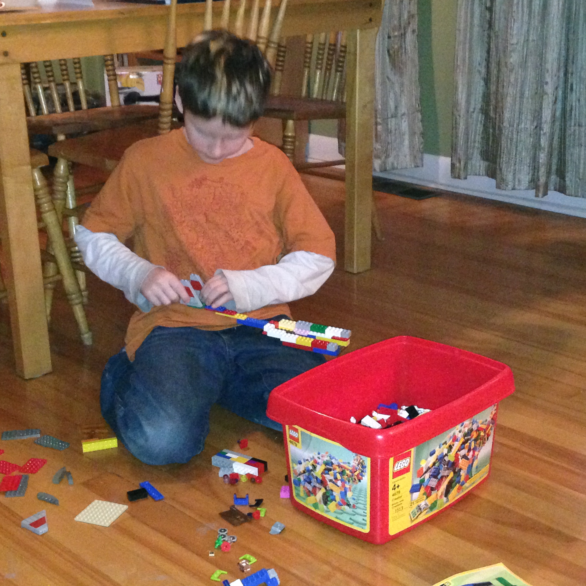 Isaac working on one of his many Lego inventions.